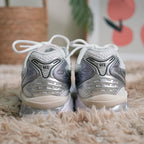 ASICS GEL-Kayano 14 Women’s — in-hand view highlighting Tiger Stripes and midsole